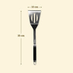 Spatule longue XL en inox de 35 cm avec tête ajourée de 10 cm, manche noir antidérapant et œillet de suspension.